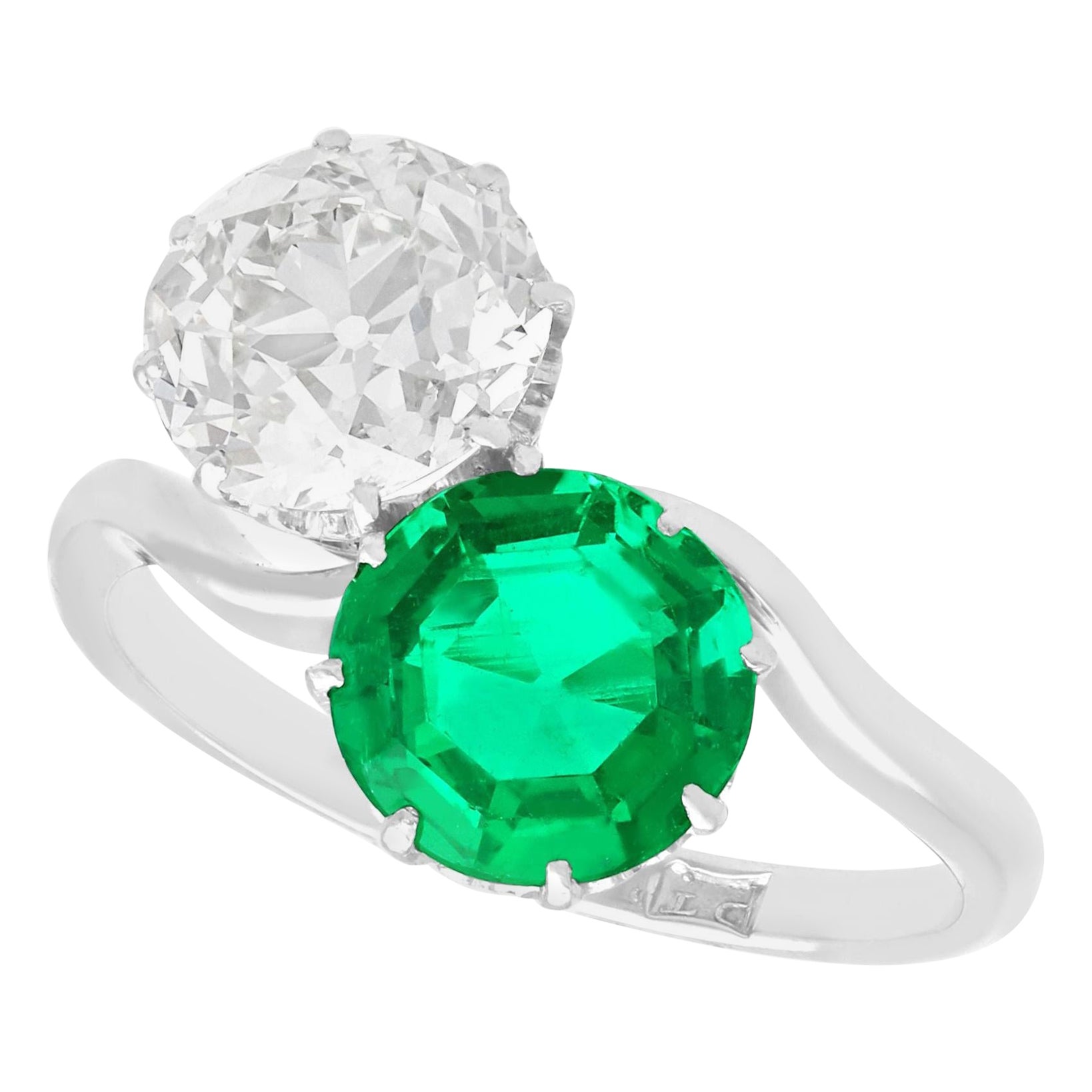 Antique 1.70 Carat Colombian Emerald and 2.18 Carat Diamond Platinum Twist Ring For Sale