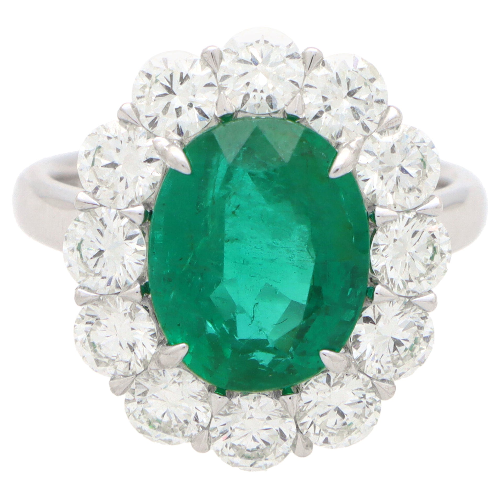 Contemporary Emerald and Diamond Cluster Engagement Ring Set in Platinum 