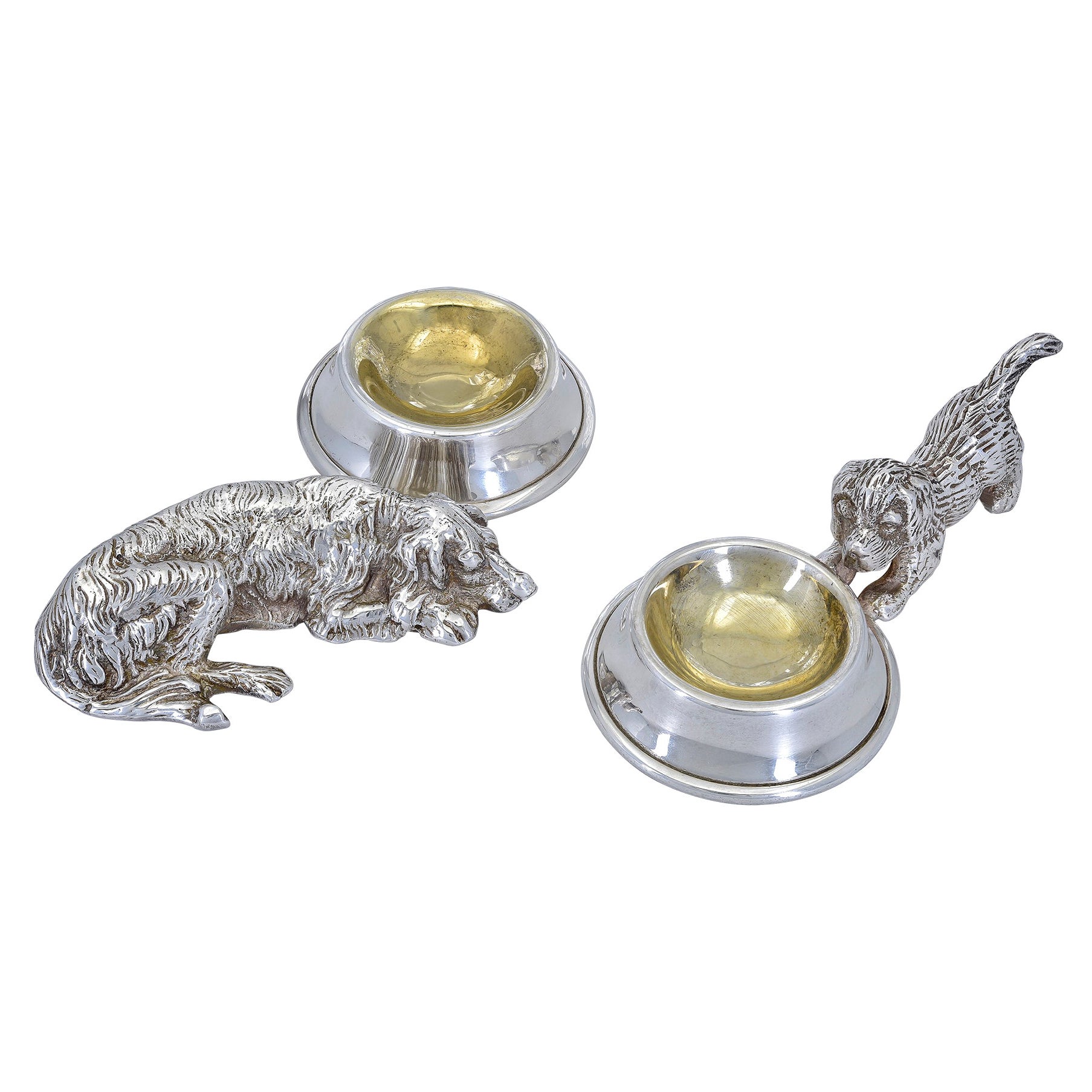 Two Figural Dogs with Gilded Bowls
