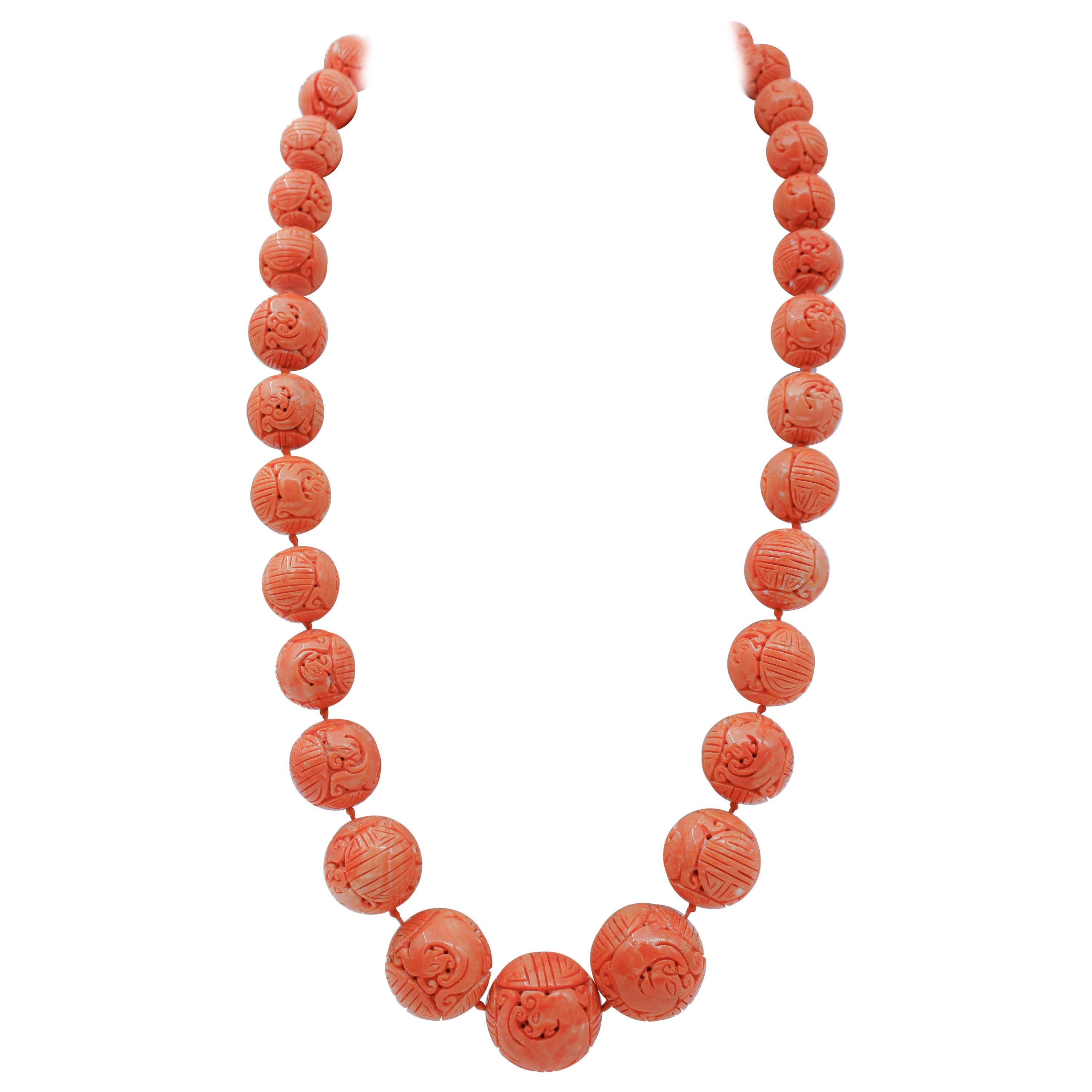 Antique collectible necklace made with large engraved coral spheres For Sale