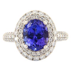 3.88 CT Oval Tanzanite and 1.20 CTW Diamond Double Frame Ring in 14K White Gold