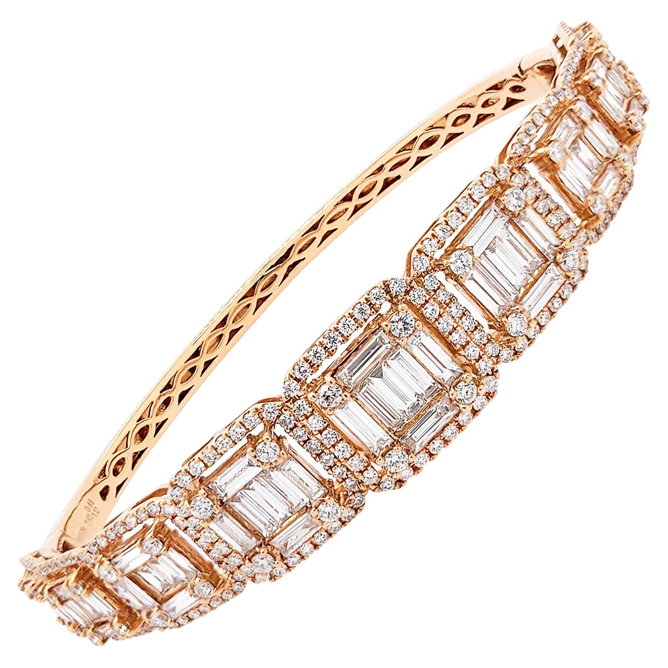 Tinged with moments of retro glamour and drenched with sparkling stones, this stylish Diamond Tapered Bangle Bracelet designed by Spectra Fine Jewelry in 2019 features 345 diamonds—both round brilliant-cut and baguette—weighing approximately 4.20