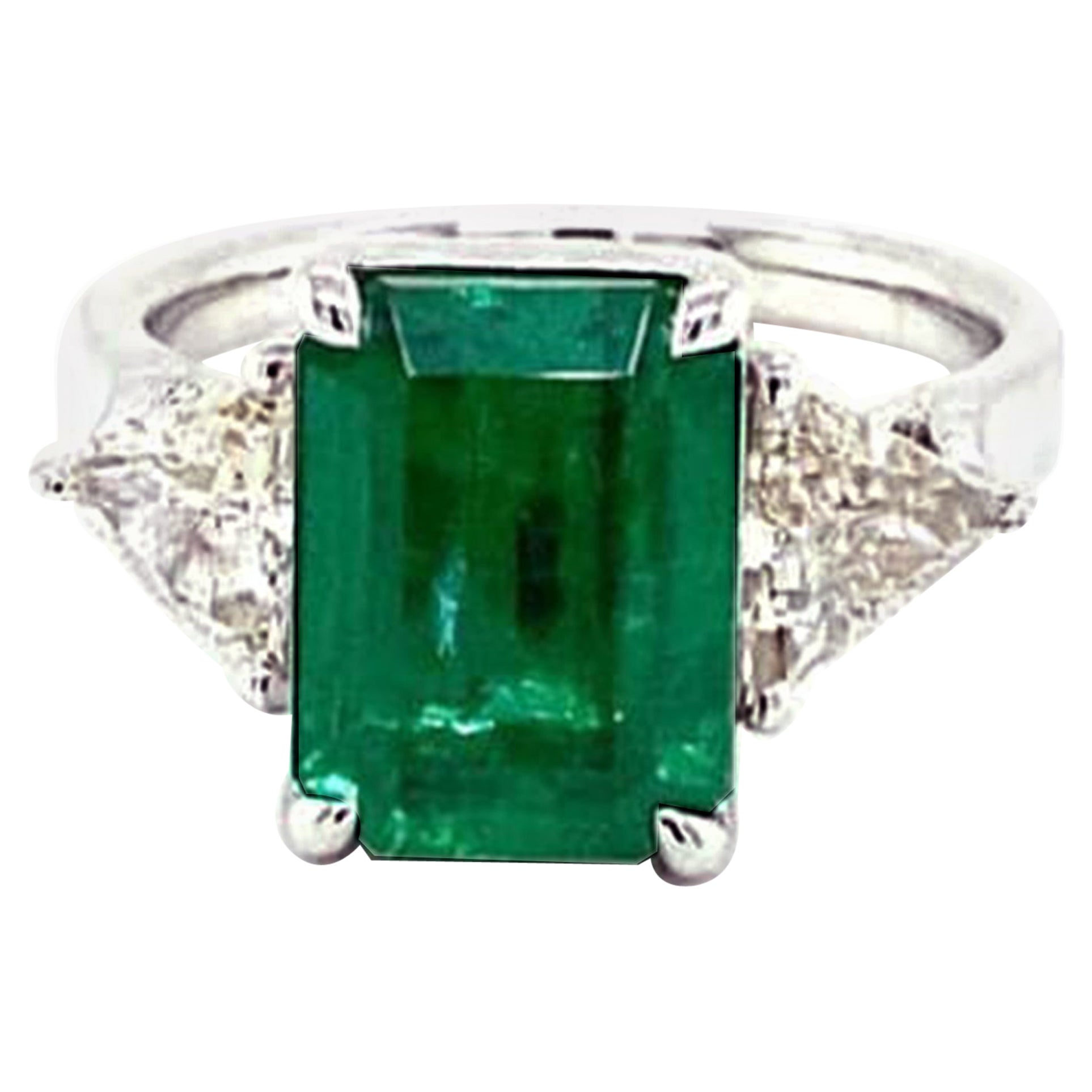 3 Stone Emerald and Trillion Diamond Ring