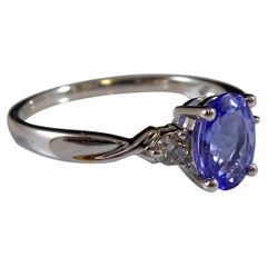 Oval Tanzanite and Diamond Three Stone Ring in Platinum