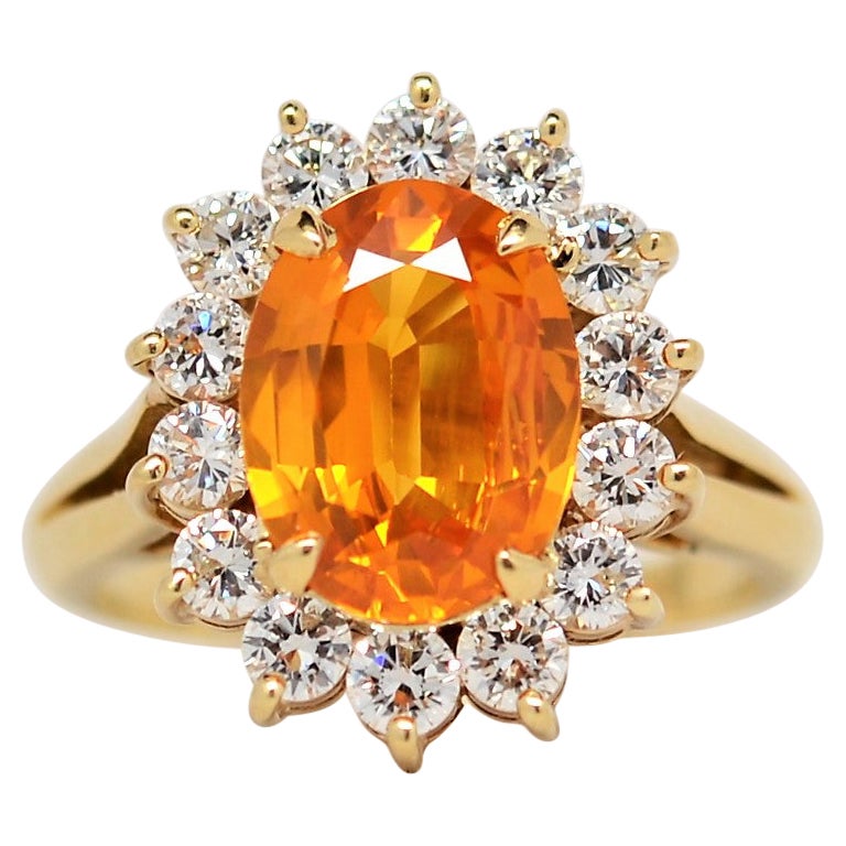Oval Brilliant Yellow Sapphire & Diamond Halo Ring set in 18K Yellow Gold