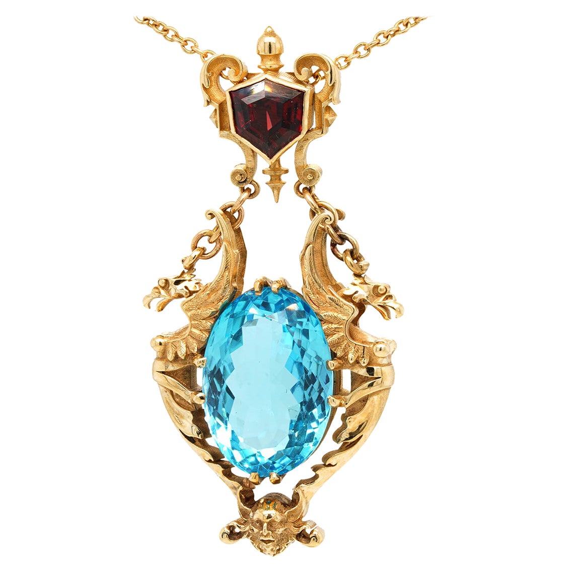 28ct Oval Swiss Blue Topaz, Garnet 9k Yellow Gold Antique Style Pendant Necklace For Sale
