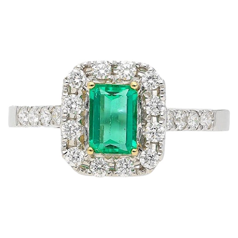 0.44 Carat Emerald Cut Natural Emerald Ring with Diamond Halo in 18k White Gold For Sale
