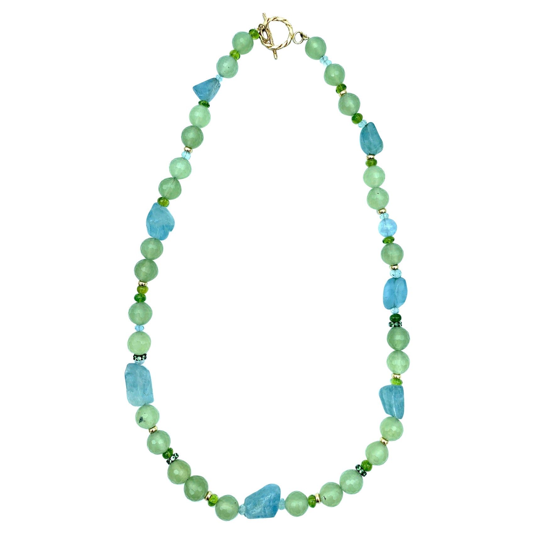 This fun and unique beaded necklace features an interesting collection of  pastel gemstones in a variety of shapes and sizes. Round, faceted prehnite beads are combined with freeform aquamarine 