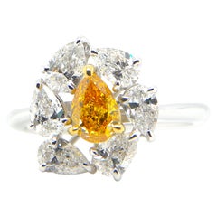 0.60 Carat GIA Certified Fancy Vivid Yellow-Orange Diamond and Diamond Ring