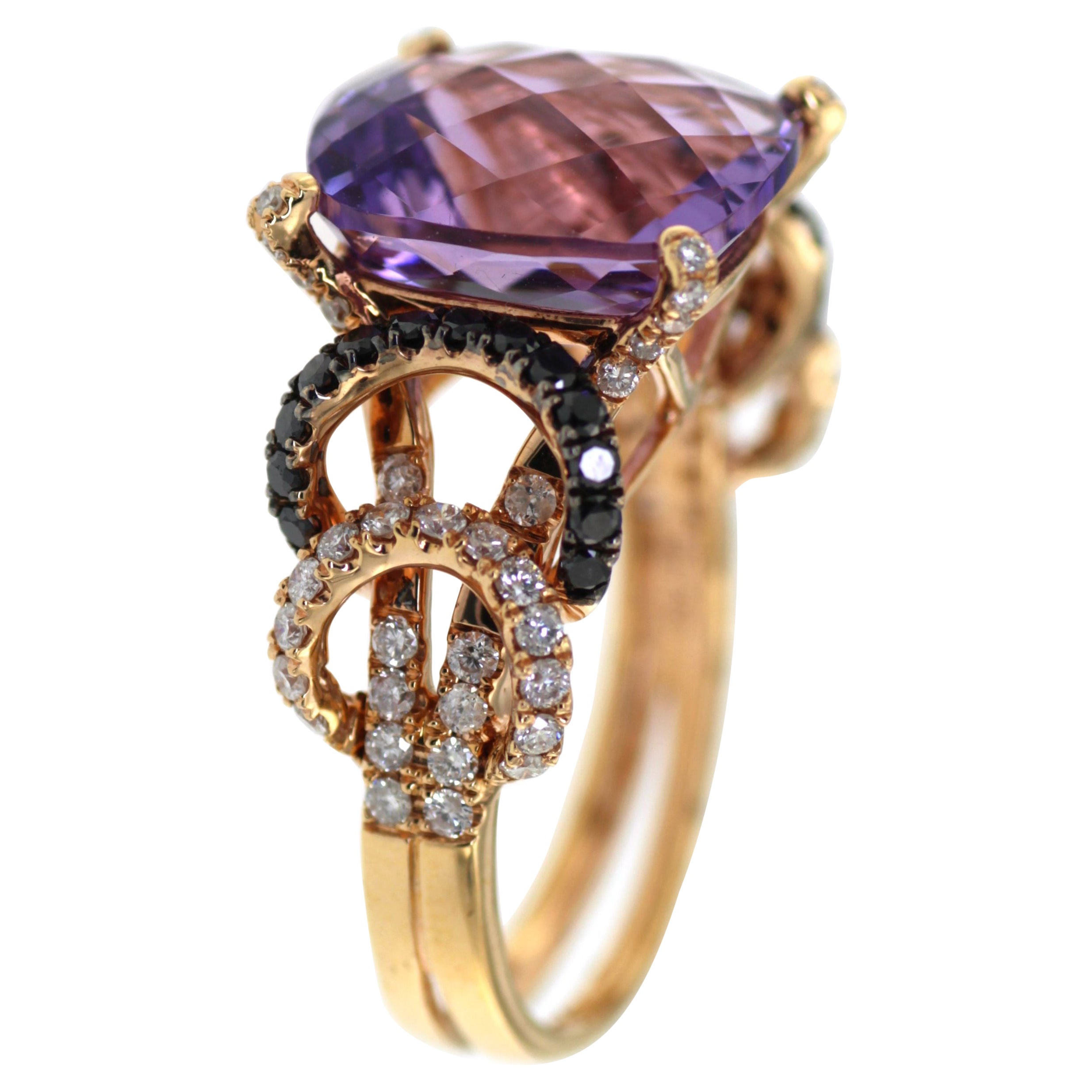 Indulge in the mesmerizing beauty of our exquisite Amethyst and Diamond Ring set in 18 Karat Rose Gold. This captivating piece showcases a magnificent 6.44 carat cushion-cut amethyst, radiating a stunning purple hue that captures the