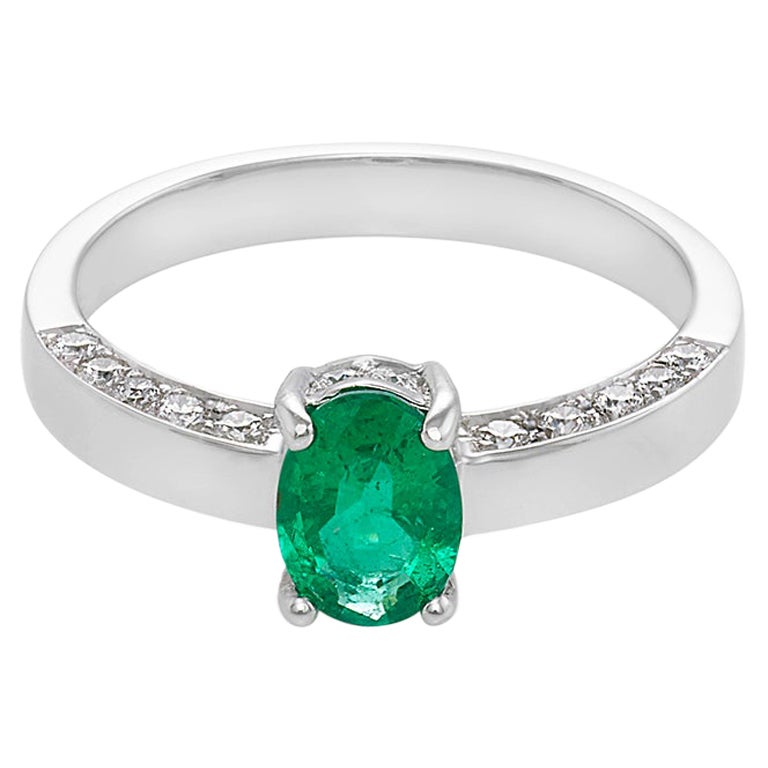 Oval Cut Natural Emerald and Round Brilliant Cut Diamond Engagement Ring
