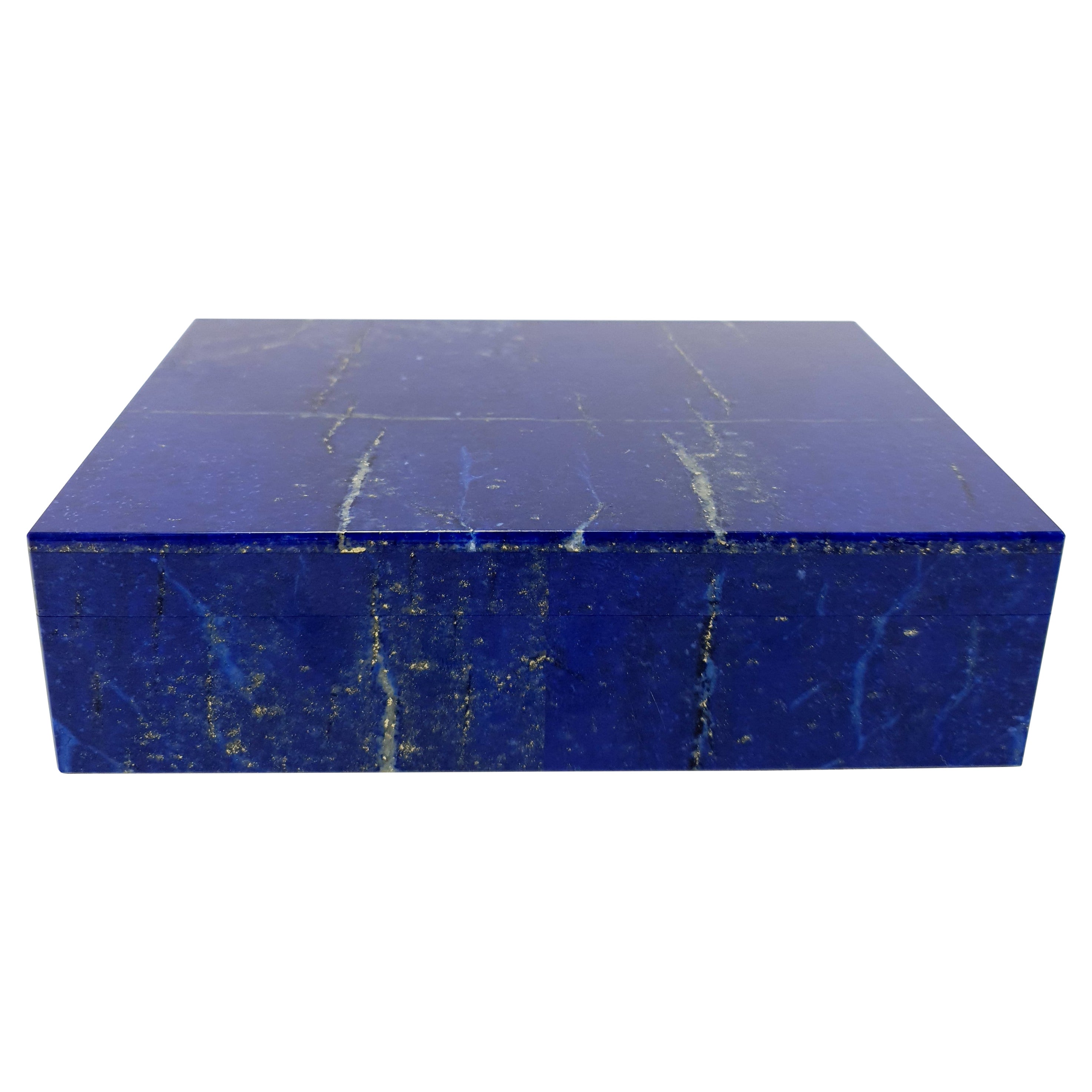 A handmade Natural White Blue Lapis Lazuli Decorative Jewelry Box.
The pattern looks like an artful painting of nature and the gold-colored pyrite sparkles beautifully.
The Frontplate is made out of two matching pieces and the Inlay is made out of