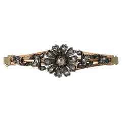 Gold Bangle with a Diamond Flower