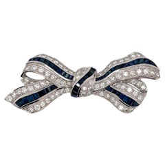 Sapphire & Diamond Bow Ribbon Brooch in 18K White Gold