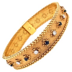 Bracelet en or jaune 18 carats avec diamants et saphirs de George Lenfant (France)