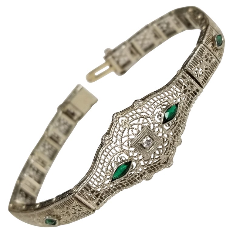 Art Deco Filigree "Belly" Bracelet in 14 Karat Gold with Diamonds and Emeralds For Sale