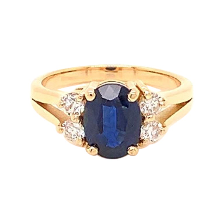 1.58 Carat Oval Cut Blue Sapphire and Diamond Ring in 18K Yellow Gold For Sale
