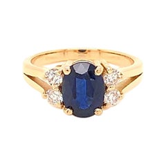 1.58 Carat Oval Cut Blue Sapphire and Diamond Ring in 18K Yellow Gold