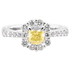 GIA Certified 0.71 Carat Natural Fancy Vivid Yellow Diamond Ring Set in Platinum