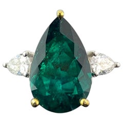 Certified 5.70 Carat Colombian Emerald and Diamond Three Stone Engagement Ring