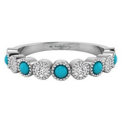 Bague en or blanc 18 carats sertie de diamants et de turquoises et de grains de diamants