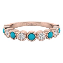 Bague sertie d'un chaton en or rose 18 carats avec diamants et turquoises