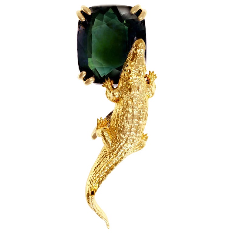 Eighteen Karat Yellow Gold Egyptian Revival Brooch with Green Sapphire For Sale