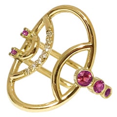 Interlocking Geometry Oval Ring with Rubies and Diamonds in 18 Karat Gold