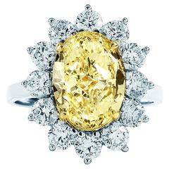 5.34 Carat GIA Oval Two Tone Platinum Yellow Gold Halo Flower Engagement Ring
