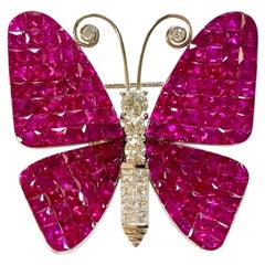 15.99 Carat Invisible Set Ruby and Diamond Brooch