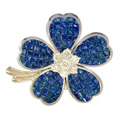 12 Carat Invisible Set Ceylon Sapphire and Diamond Flower Brooch