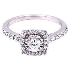 Anillo solitario de oro blanco de 14 quilates con un diamante de corte redondo de 0,56 quilates