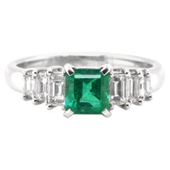 0.72 Carat Natural Emerald and Diamond Engagement Ring Set in Platinum
