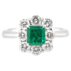 1.04 Carat Natural Emerald and Diamond Halo Engagement Ring Set in Platinum