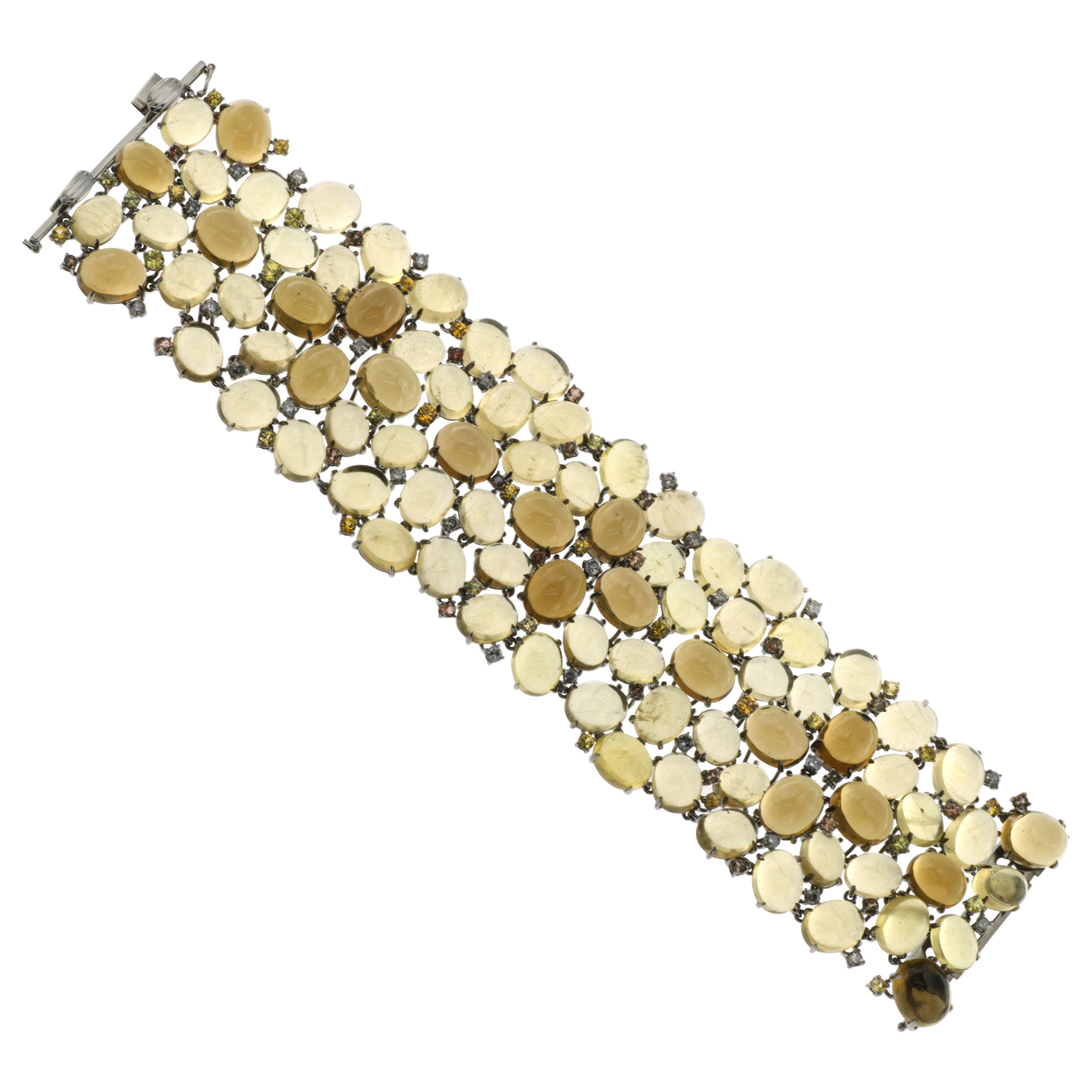 Bracelet en or jaune 18 carats avec béryl jaune et saphirs