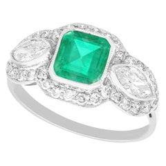 Anillo de compromiso antiguo en platino con esmeralda de 1,45 quilates y diamante de 1,43 quilates