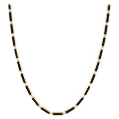 Collier à barre station en or jaune 14 carats et onyx noir