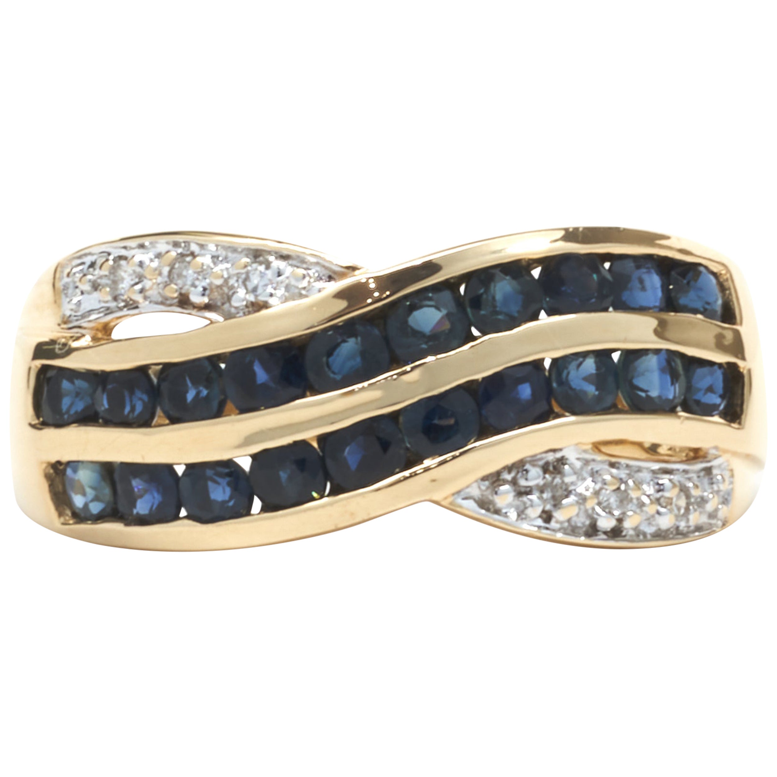 14 Karat Yellow Gold Sapphire and Diamond Crossover Ring For Sale