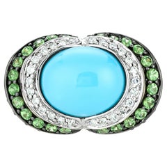 Anello Carlo Viani in oro giallo 14K con turchese cabochon e tsavorite con diamante bianco