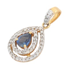 Pendentif en or jaune massif 18 carats avec saphir bleu poire et double halo de diamants