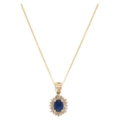 Stunning Classic Sapphire & .25 CTW Diamond Halo Pendant Necklace in 14K