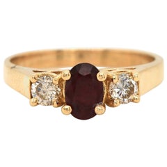 0.60ct Oval Ruby and 0.28ctw Diamond Three Stone Ring in 18K Yellow Gold