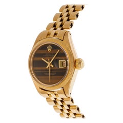 Rolex Oyster Perpetual Date Just Armbanduhr aus 18 Karat Gelbgold mit Tigerauge-Zifferblatt
