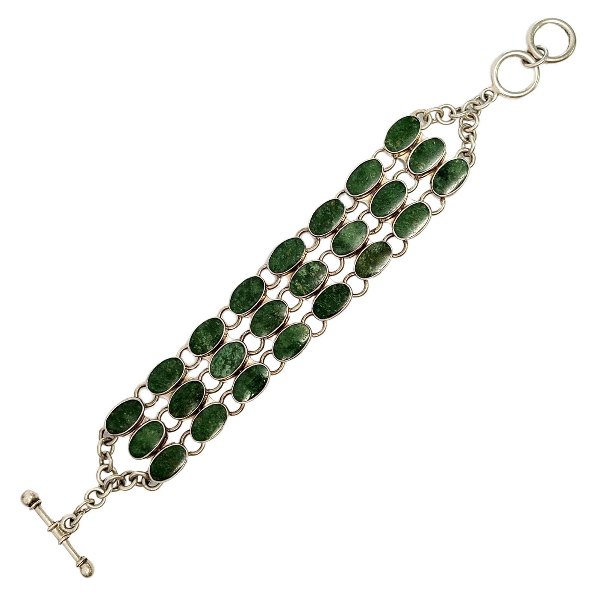 Bracelet large à bascule en argent et pierres vertes