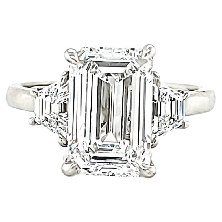 Louis Newman & Co GIA Certified 3.01 Carat Emerald Cut Diamond Three Stone Ring For Sale