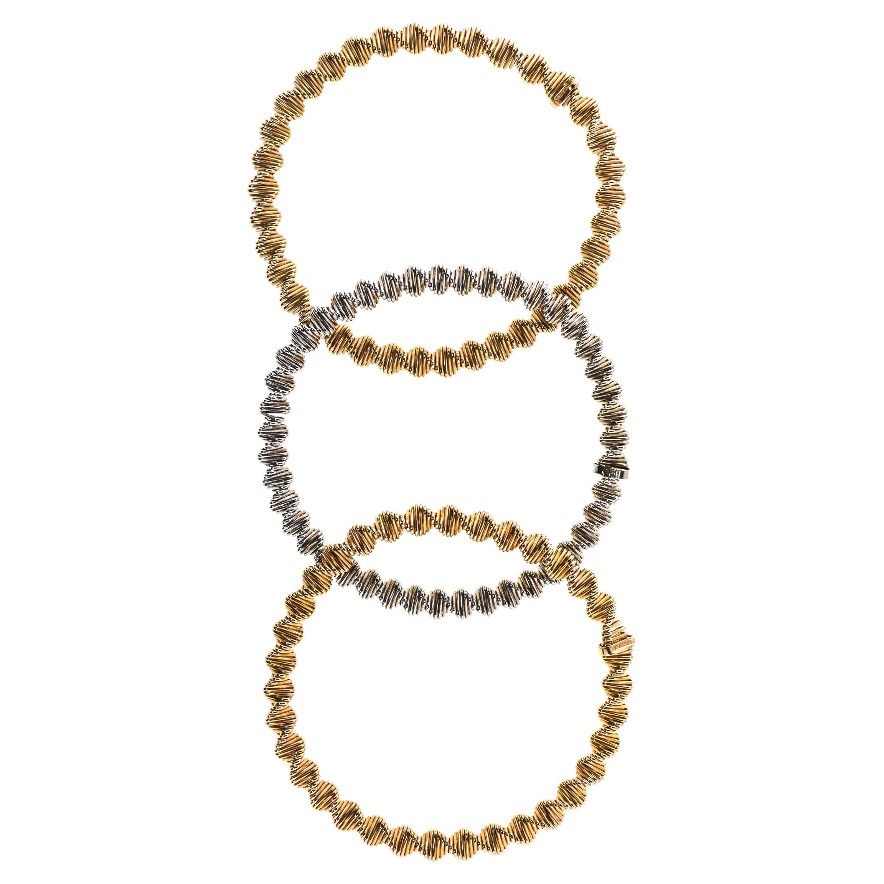 Carlo Weingrill ensemble de trois bracelets à roulettes en or bicolore 18 carats en vente