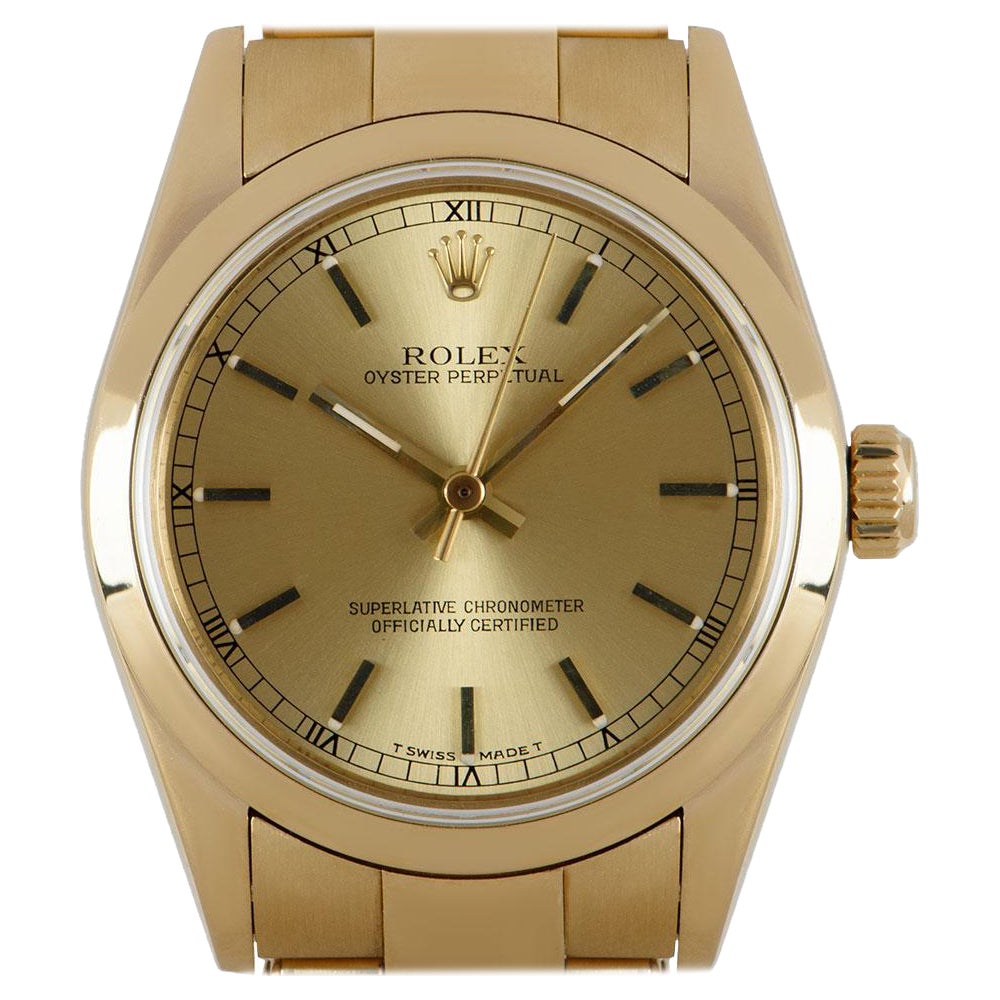 Rolex Oyster Perpetual Mid-Size 18k Yellow Gold Champagne Dial 67488