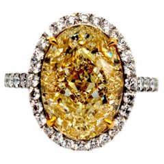 Six Carat Light Yellow Oval VVS1 Halo Ring GIA