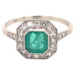 Bague vintage en platine avec diamants et émeraudes de 0,95 carat