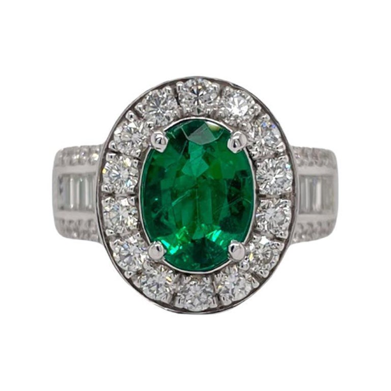 Oval Emerald & Diamond Halo Ring in 18K White Gold